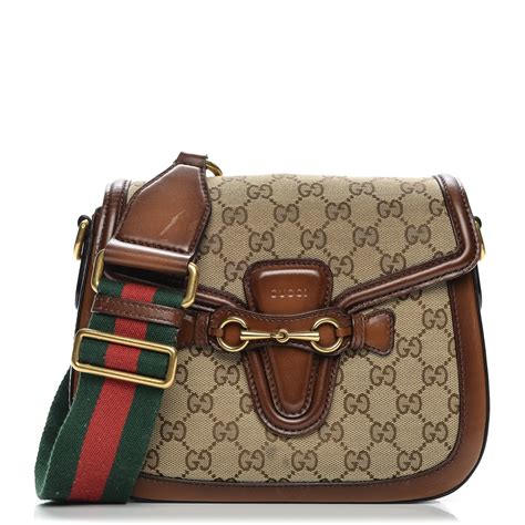 gucci light brown monogra on top and ends of handbag|Gucci shoulder bag brown.